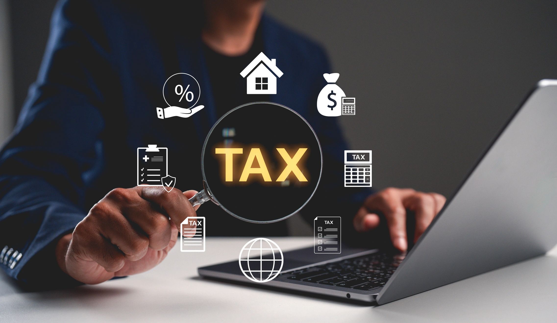 Tax services magnifying glass with financial icons